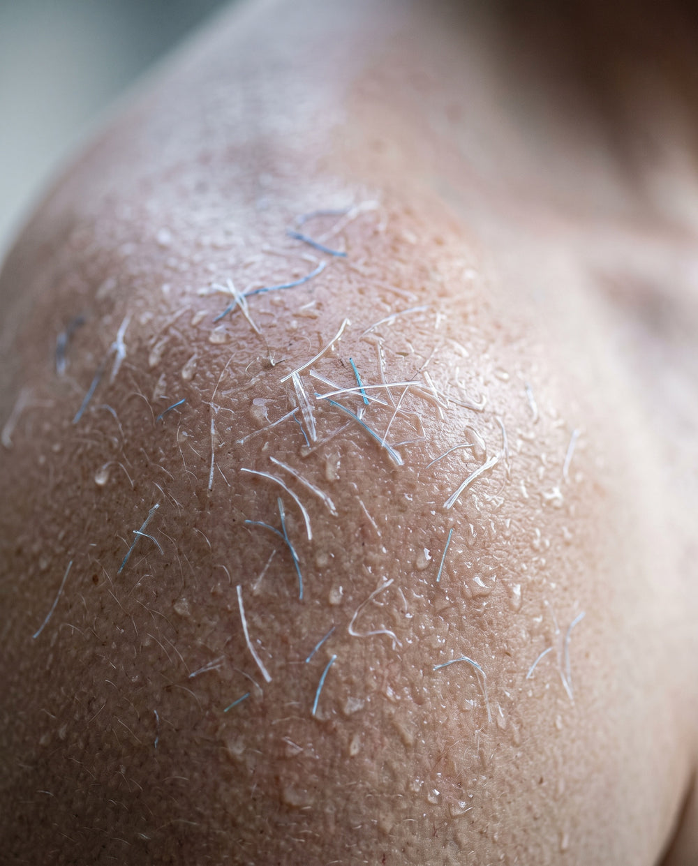 YOUR PORES OPEN WHEN YOU SWEAT. PLASTIC FIBERS TAKE THE OPENING.